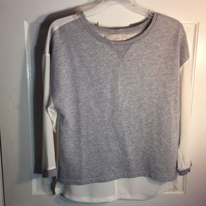Gray knit sweater with silk back.